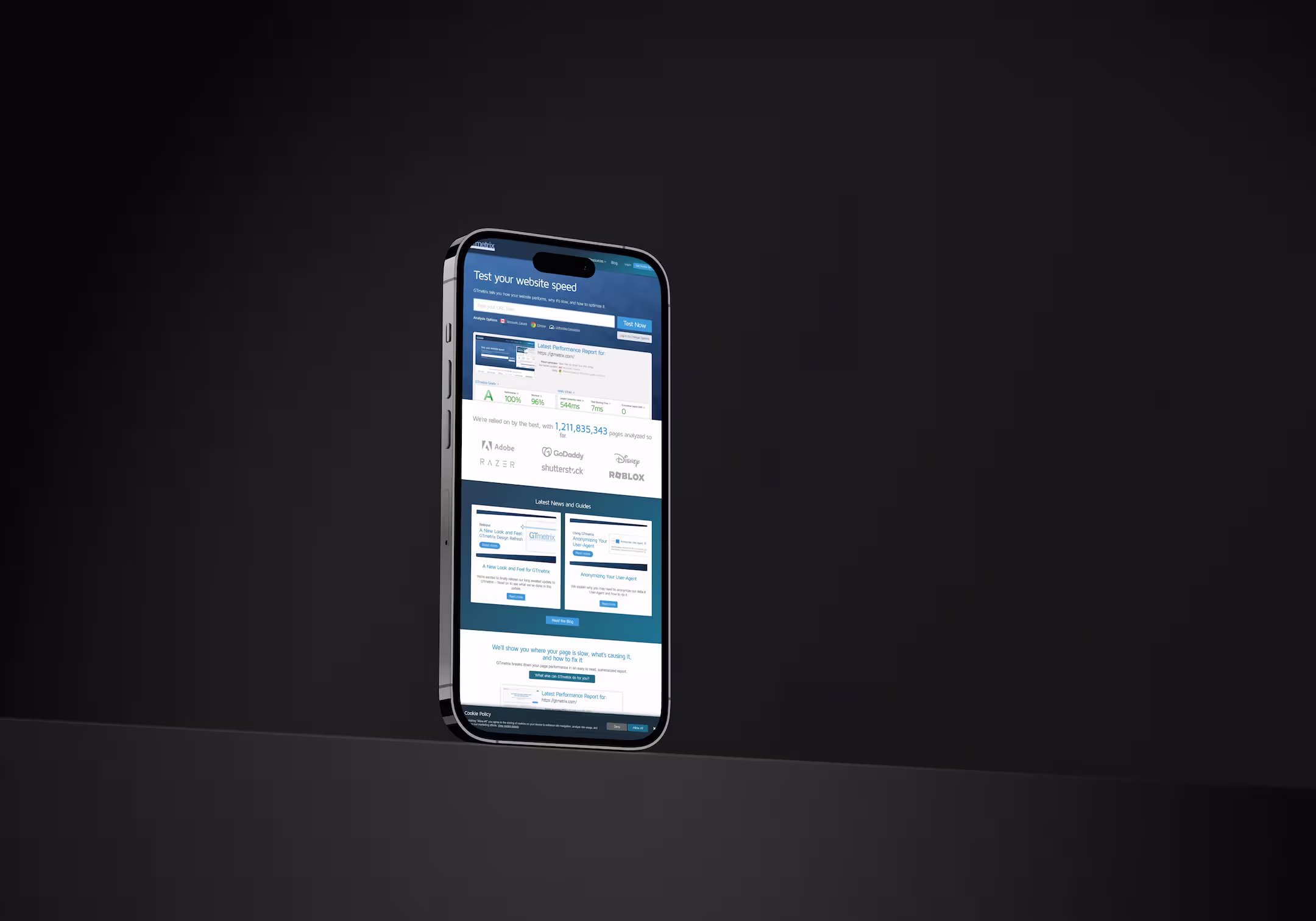 A mobile phone with the GTMetrix website.