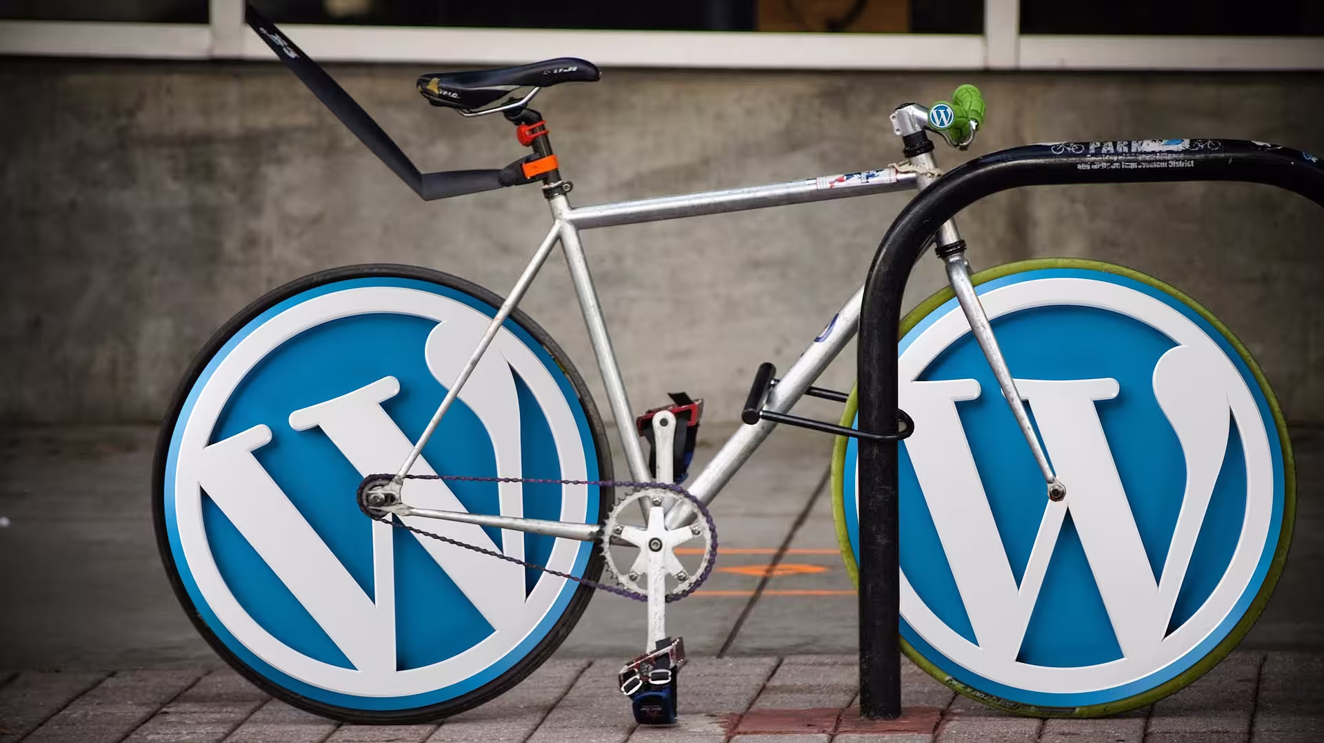 Picture of a bike locked up with WordPress style wheels