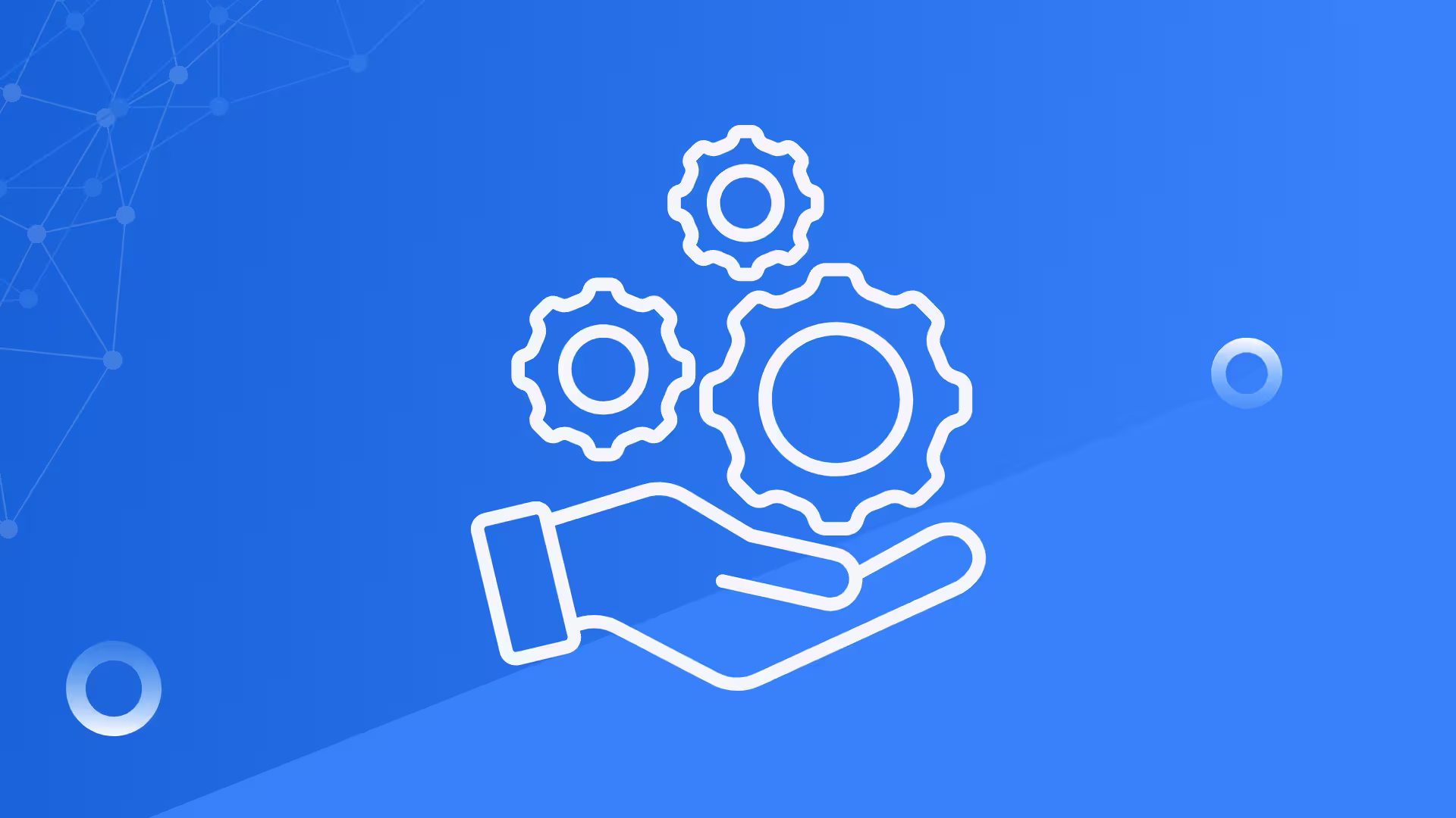 Hand holding three cogs