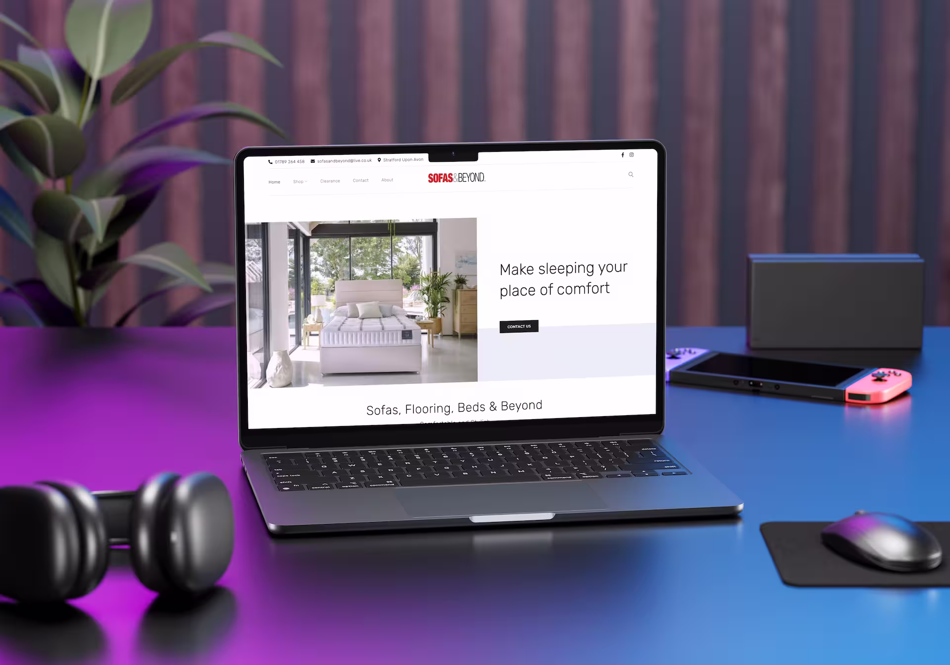 A laptop surrounded by technology in a modern environment.